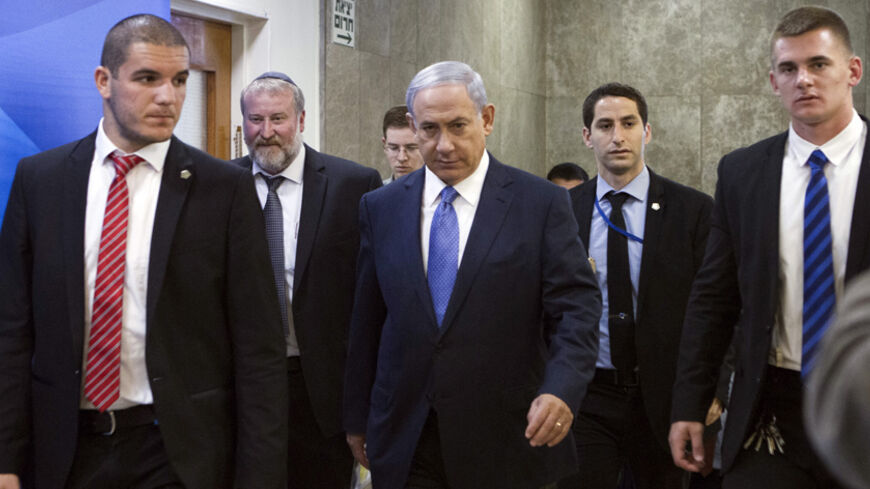 Israel's Prime Minister Benjamin Netanyahu (C) arrives to the weekly cabinet meeting in Jerusalem March 29, 2015. Netanyahu condemned on Sunday the framework Iranian nuclear agreement being sought by international negotiators, saying it was even worse than his country had feared. REUTERS/Dan Balilty/Pool
 - RTR4VCEV