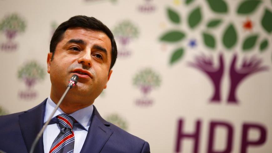 Selahattin Demirtas, co-chairman of the pro-Kurdish Peoples' Democracy Party (HDP), addresses his party members as he starts his campaign for Turkey's June 7 parliamentary elections, during a meeting in Ankara April 10, 2015. REUTERS/Umit Bektas  - RTR4WSQ9