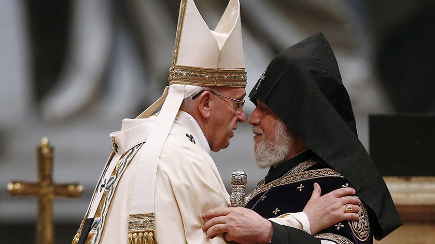 Pope Francis (L) embraces Catholicos of All Armenians Karekin II during a mass on the 100th anniversary of the Armenian mass killings, in St. Peter's Basilica at the Vatican April 12, 2015. Pope Francis on Sunday commemorated the 100th anniversary of the massacre of as many as 1.5 million Armenians as "the first genocide of the 20th century," words that could draw an angry reaction from Turkey. REUTERS/Tony Gentile       TPX IMAGES OF THE DAY      - RTR4WZDR