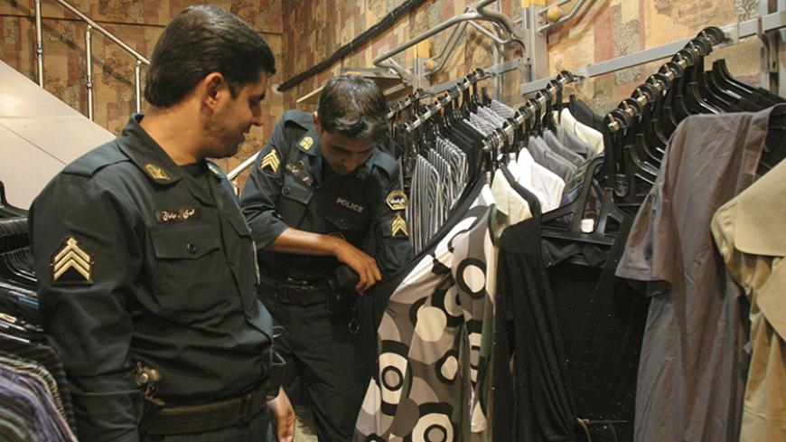 Morality police show examples of unacceptable women's clothing to the media during a crackdown on "social corruption" in north Tehran June 18, 2008. Picture taken June 18, 2008.  REUTERS/Stringer (IRAN) - RTX73ZM
