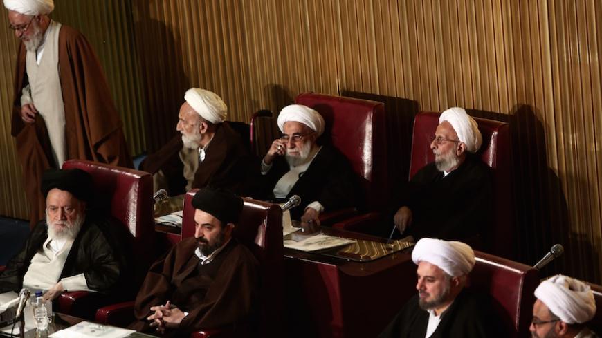 Members of Iran's Assembly of Experts, Mohammad Taghi Mesbah-Yazdi (up-R) and head of the Guardian Council, Ahmad Janati (up-C), attend a session to appoint a new chairman on March 10, 2015 in Tehran. The Assembly of Experts, the clerics who appoint and can dismiss the country's supreme leader, picked the ultraconservative Ayatollah Mohammad Yazdi as their new chairman in a surprise appointment. AFP PHOTO / BEHROUZ MEHRI        (Photo credit should read BEHROUZ MEHRI/AFP/Getty Images)