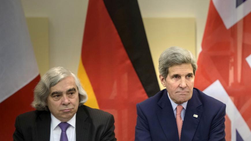 US Secretary of Energy Ernest Moniz (L) and US Secretary of State John Kerry wait for the start of a trilateral meeting at the Beau Rivage Palace Hotel in Lausanne March 28, 2015. The foreign ministers of France and Germany joined the top U.S. and Iranian diplomats on Saturday to help break an impasse in nuclear negotiations as major powers and Iran closed in on a 2- or 3-page accord that could form the basis of a long-term deal. REUTERS/Brendan Smialowski/Pool - RTR4V9Q6