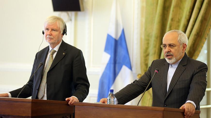 Iranian Foreign Minister Mohammad Javad Zarif (R) and his Finnish counterpart Erkki Tuomioja hold a joint press conference following a meeting in the capital Tehran, on August 31, 2014. Tuomioja pays a two-day visit to the Islamic Republic during which he is expected to meet high-ranking Iranian officials.   AFP PHOTO/ATTA KENARE        (Photo credit should read ATTA KENARE/AFP/Getty Images)