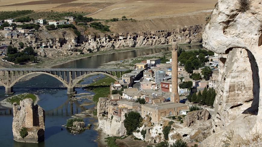 The Tigris river, with the minaret of a 14th century mosque on the right, flows through the town of Hasankeyf in southeastern Turkey, August 14, 2009. Western export credit insurers quit Turkey's planned Ilisu dam on the Tigris River on July because it failed World Bank environmental and heritage standards, but Ankara said the 1.2 billion euro project would go ahead. Turkey said it was determined to go ahead with the dam project in its impoverished southeast, a region long scarred by unemployment and Kurdis
