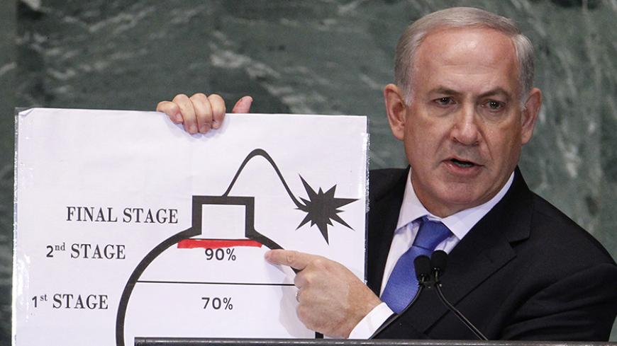 Israel's Prime Minister Benjamin Netanyahu points to a red line he drew on the graphic of a bomb used to represent Iran's nuclear program as he addresses the 67th United Nations General Assembly at the U.N. Headquarters in New York, September 27, 2012. The red line represents a point where he believes the international community should tell Iran that they will not be allowed to pass without intervention. REUTERS/Lucas Jackson (UNITED STATES - Tags: POLITICS) - RTR38I79