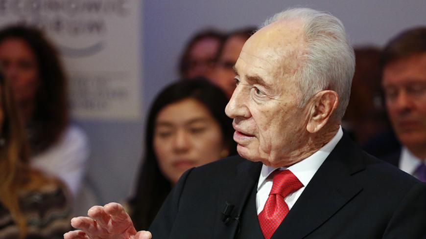 Former Israeli president Shimon Peres speaks during the An Insight, An Idea with Shimon Peres event in the Swiss mountain resort of Davos January 22, 2015. More than 1,500 business leaders and 40 heads of state or government attend the Jan. 21-24 meeting of the World Economic Forum (WEF) to network and discuss big themes, from the price of oil to the future of the Internet. This year they are meeting in the midst of upheaval, with security forces on heightened alert after attacks in Paris, the European Cent