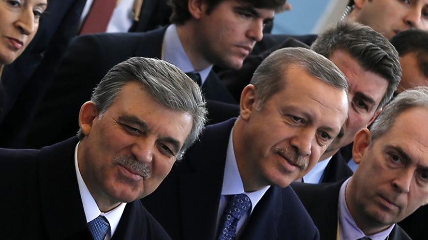 Turkish President Abdullah Gul (L) and Prime Minister Tayyip Erdogan arrive at an opening ceremony of a new line of the Ankara Metro in Ankara February 12, 2014. REUTERS/Umit Bektas (TURKEY - Tags: POLITICS) - RTX18NXZ