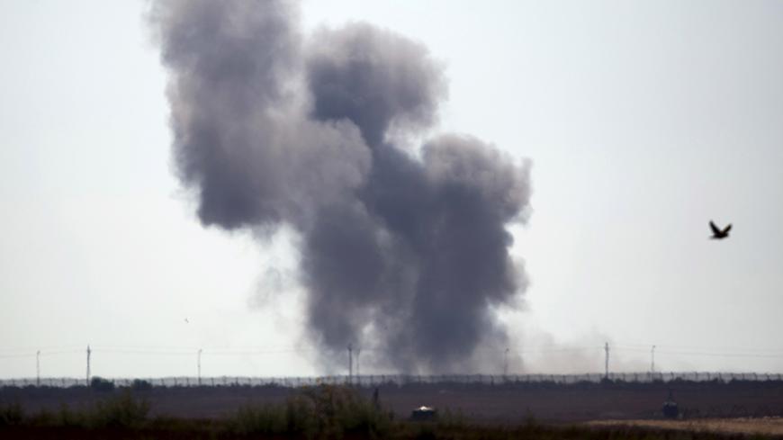 Smoke rises in Egypt's North Sinai along the border with southern Israel, July 1, 2015. Islamic State militants launched a wide-scale coordinated assault on several military checkpoints in Egypt's North Sinai on Wednesday in which 50 people were killed, security sources said, the largest attack yet in the insurgency-hit province. Egyptian army F-16 jets and Apache helicopters strafed the region that lies within the Sinai Peninsula, a strategic area located between Israel, the Gaza Strip and the Suez Canal. 