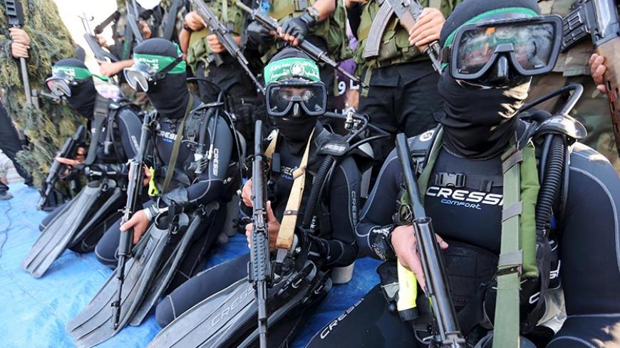 Palestinian members of the marine unit of al-Qassam Brigades, the armed wing of the Hamas movement, take part in an anti-Israel parade in Rafah, in the southern Gaza Strip July 13, 2015. 
REUTERS/Ibraheem Abu Mustafa






 - RTX1K8PX