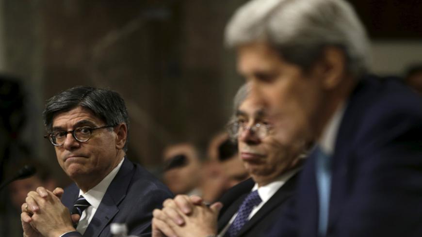 U.S. Secretary of the Treasury Jack Lew (L) listens to U.S. Secretary of State John Kerry (R) as they appear before the Senate Foreign Relations Committee in Washington July 23, 2015. U.S. lawmakers skeptical about the nuclear deal with Iran promised to press senior Obama administration officials to make more information about it public at a Senate hearing on Thursday as Congress begins its two-month review of the agreement.
 REUTERS/Gary Cameron
 - RTX1LJNB
