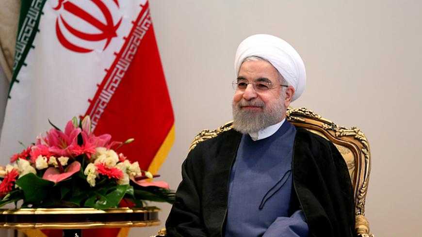 Iranian President Hassan Rouhani smiles during a meeting with German Economy and Energy Minister Sigmar Gabriel (unseen) in Tehran on July 20, 2015. Gabriel flew to Iran, becoming the first top Western official to visit the country since world powers and Tehran reached a historic nuclear deal. AFP PHOTO / ATTA KENARE        (Photo credit should read ATTA KENARE/AFP/Getty Images)