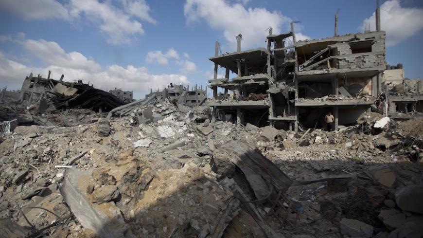 A view of the rubble of destroyed buildings and homes in the Shejaiya residential district of Gaza City on July 26, 2014. The bodies of at least 35 Palestinians were recovered from rubble across Gaza in the three hours since a humanitarian truce came into effect, raising to over 900 the overall death toll of Israel's onslaught on the territory since July 8, medics said. Thirteen bodies were recovered in Shejaiya in eastern Gaza City, 13 more in Deir al-Balah and Nusseirat in central Gaza, and nine in north 