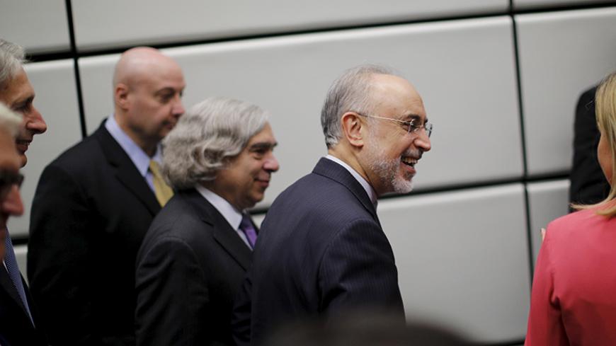 The head of the Iranian Atomic Energy Organization Ali Akbar Salehi and U.S. Secretary of Energy Ernest Moniz (3rd R) leave after a group picture at the United Nations building in Vienna, Austria July 14, 2015. Iran and six major world powers reached a nuclear deal on Tuesday, capping more than a decade of on-off negotiations with an agreement that could potentially transform the Middle East, and which Israel called an "historic surrender".   REUTERS/Carlos Barria - RTX1KA5B