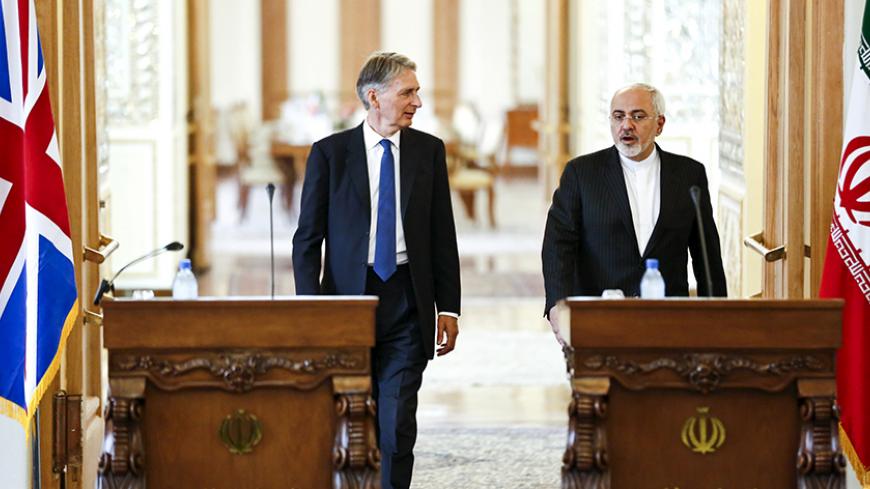 Britain's Foreign Secretary Philip Hammond (L) and his Iranian counterpart Mohammad Javad Zarif arrive for presser, after a meeting at the Ministry of Foreign Affairs in Tehran August 23, 2015. REUTERS/Raheb Homavandi/TIMAATTENTION EDITORS - THIS PICTURE WAS PROVIDED BY A THIRD PARTY. REUTERS IS UNABLE TO INDEPENDENTLY VERIFY THE AUTHENTICITY, CONTENT, LOCATION OR DATE OF THIS IMAGE. FOR EDITORIAL USE ONLY. NOT FOR SALE FOR MARKETING OR ADVERTISING CAMPAIGNS. NO THIRD PARTY SALES. NOT FOR USE BY REUTERS THI