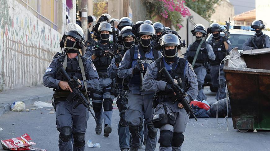 Israeli policemen patrol a street in the Arab east Jerusalem neighbourhood of Jabel Mukaber following clashes in Jerusalem  September 18, 2015. Israel deployed hundreds of extra police around the Old City of Jerusalem on Friday after Palestinian leaders called for a 'day of rage' to protest at new Israeli security measures. In an effort to limit the threat of violence, Israel also banned access to al-Aqsa for all men under 40 on Friday, the Muslim holy day. REUTERS/Ammar Awad - RTS1S1V