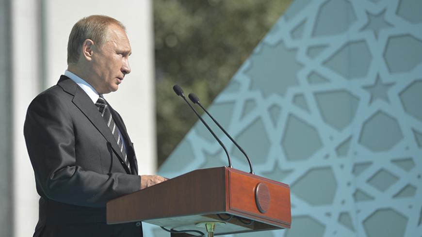 Russian President Vladimir Putin delivers a speech during a ceremony to open the Moscow Grand Mosque in Moscow, Russia, September 23, 2015. The new mosque, which was erected on the site of the city's original mosque built in 1904 and which has been under reconstruction since 2005, will be able to accommodate up to 10,000 people simultaneously, according to local media. REUTERS/Alexei Druzhinin/RIA Novosti/Kremlin ATTENTION EDITORS - THIS IMAGE HAS BEEN SUPPLIED BY A THIRD PARTY. IT IS DISTRIBUTED, EXACTLY A