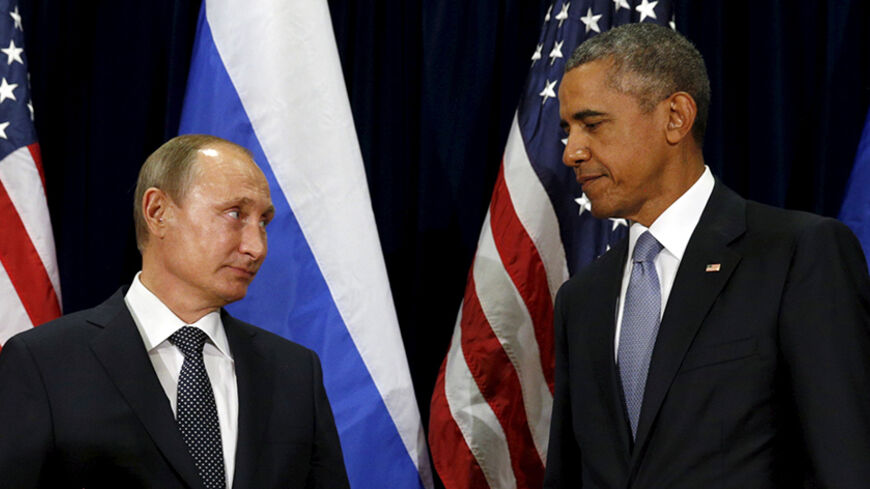 U.S. President Barack Obama and Russian President Vladimir Putin look towards one another during their meeting at the United Nations General Assembly in New York September 28,  2015. REUTERS/Kevin Lamarque  - RTX1SYAC