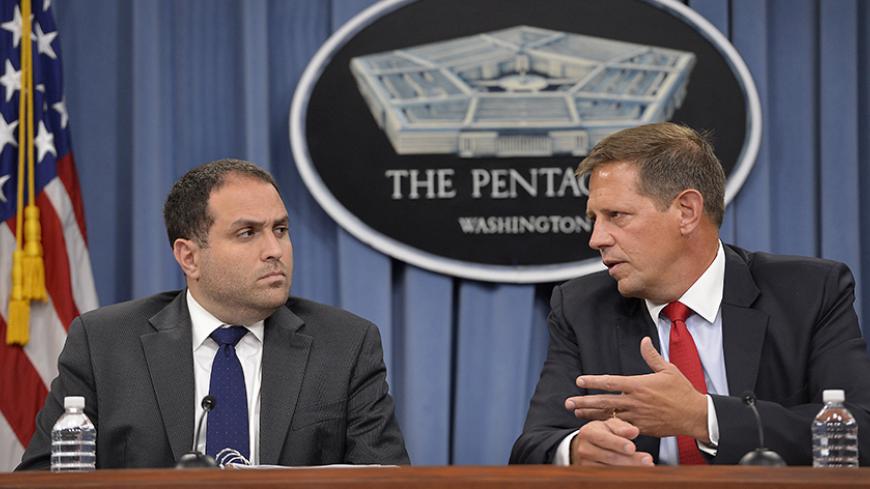 130730-D-NI589-235 Acting Assistant Secretary of Defense for Asia Pacific Security Affairs Peter Lavoy, right, and State Department Deputy to the Special Representative to Afghanistan and Pakistan Jarrett Blanc brief the press on a report titled, "Progress Toward Security and Stability in Afghanistan," in the Pentagon in Arlington, Va., on July 30, 2013.  DoD photo by Glenn Fawcett.  (Released)