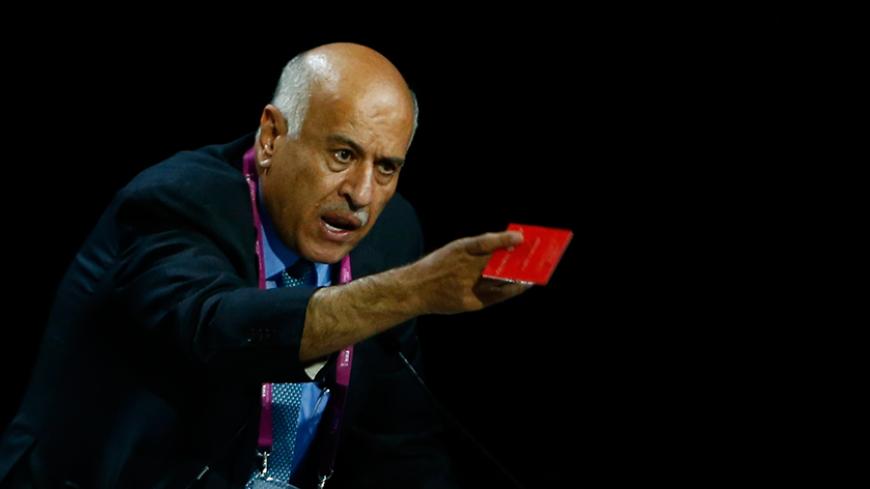 Jibril Al Rajoub, President of Palestinian Football Association, gestures with a red card as he addresses the 65th FIFA Congress in Zurich, Switzerland, May 29, 2015.                 REUTERS/Arnd Wiegmann   - RTR4Y0T2