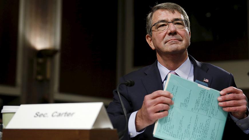 United States Secretary of Defense Ash Carter prepares to testify at a Senate Armed Forces Committee hearing on "United States Strategy in the Middle East" in Washington October 27, 2015. REUTERS/Gary Cameron     - RTX1TGBO