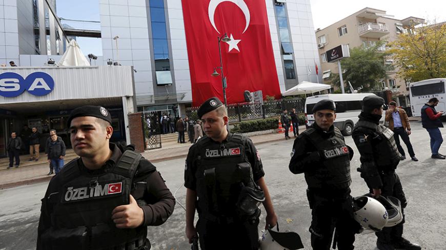 Riot police stand guard outside the Kanalturk and Bugun TV building in Istanbul, Turkey, October 28, 2015. Turkish police on Wednesday stormed the offices of an opposition media company, days before an election, in a crackdown on companies linked to a U.S.-based cleric and foe of President Tayyip Erdogan, live footage showed. Brawls broke out and police sprayed water cannon to disperse dozens of people in front of the offices of Kanalturk and Bugun TV in Istanbul, a live broadcast on Bugun's website showed.