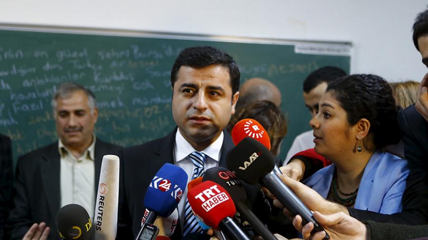 Selahattin Demirtas, co-chairman of the pro-Kurdish Peoples' Democratic Party (HDP), talks to the media before casting his ballot at a polling station during a general election in Istanbul, Turkey November 1, 2015.  Turks began voting on Sunday amid worsening security and economic worries in a snap parliamentary election that could profoundly impact the divided country's trajectory and that of President Tayyip Erdogan. The parliamentary poll is the second in five months, after the ruling AK Party founded by