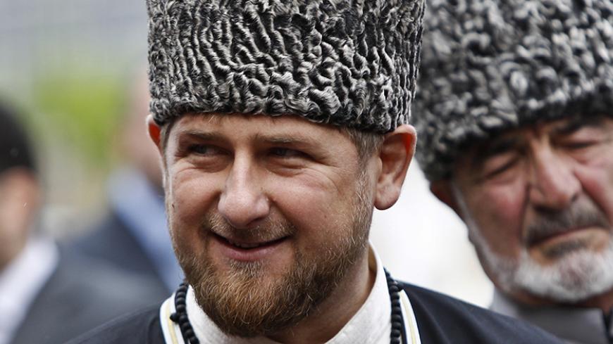 Chechen leader Ramzan Kadyrov smiles during a government organised event marking Chechen language day in central Grozny April 25, 2013. REUTERS/Maxim Shemetov (Russia - Tags: SOCIETY POLITICS RELIGION) - RTXZ5U7