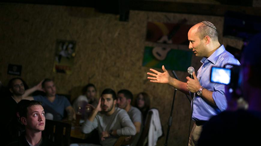 Naftali Bennett, head of the Beit Yehudi (Jewish Home) party, campaigns at a bar in the southern city of Ashdod December 27, 2012. A Palestinian state would be suicide for Israel, says Bennett, a high-tech millionaire who heads a far-right party whose popularity has been the surprise of the country's election campaign. Picture taken December 27, 2012. To match Interview story ISRAEL-ELECTION/BENNETT REUTERS/Amir Cohen (ISRAEL - Tags: POLITICS ELECTIONS) - RTR3C8SR