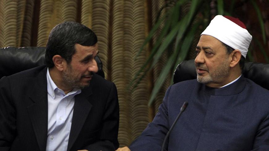 Iran's President Mahmoud Ahmadinejad speaks with Sheikh Ahmed al-Tayeb, Egypt's leading Sunni Muslim scholar at the historic al-Azhar mosque and university, in Cairo February 5, 2013. Mahmoud Ahmadinejad was both kissed and scolded on Tuesday when he began the first visit to Egypt by an Iranian president since Tehran's 1979 Islamic revolution. The trip was meant to underline a thaw in relations since Egyptians elected an Islamist head of state, President Mohamed Mursi, last June. But it also highlighted dee