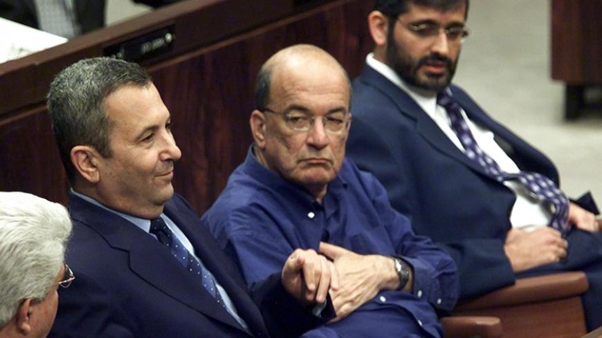 FILE PHOTO 7JUN00 - Israeli Prime Minister Ehud Barak (L) sitting with the leaders of the Meretz party, Yossi Sarid (C) and the ultra-Orthodox Shas party, Eli Yishai (R) as a vote is taken sponsored by the opposition calling for new elections. Barak lost the vote with the Shas party voting against the coalition government. Today June 13 the Shas party quit Barak's ruling coalition government over educational funds it has not received. The 17-member Shas party Knesset members are expected to submit their res