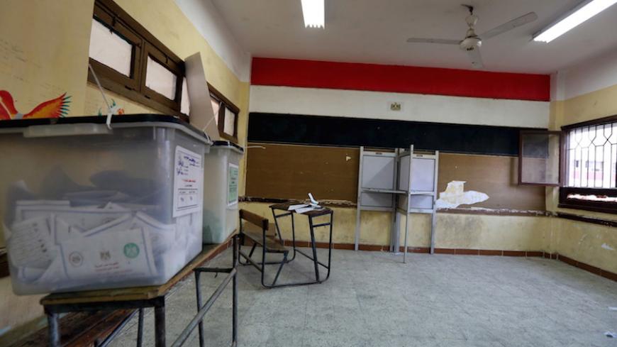 An empty polling station is seen during the second round of parliamentary election at Shubra area in Cairo, Egypt, November 23, 2015.  REUTERS/Mohamed Abd El Ghany - RTX1VGQP