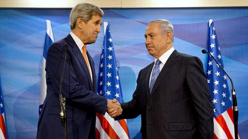 U.S. Secretary of State John Kerry (L) shakes hands with Israeli Prime Minister Benjamin Netanyahu before their meeting at the Prime Minister's Office in Jerusalem, November 24, 2015.  REUTERS/Jacquelyn Martin/Pool - RTX1VJZM