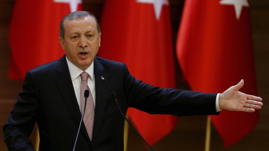 Turkish President Tayyip Erdogan makes a speech during his meeting with mukhtars at the Presidential Palace in Ankara, Turkey, November 26, 2015. REUTERS/Umit Bektas - RTX1VY0U