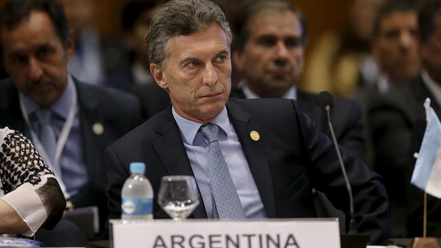 Argentina's President Mauricio Macri attends a session of the Summit of Heads of State of MERCOSUR and Associated States and 49th Meeting of the Common Market Council in Luque, Paraguay, December 21, 2015. REUTERS/Jorge Adorno - RTX1ZMNH