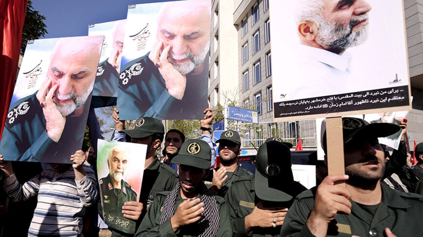 Members of Iran's Revolutionary Guards hold pictures of their Brigadier General Hossein Hamedani during his funeral in Tehran, Iran in this October 11, 2015 file photo. REUTERS/Raheb Homavandi/TIMA/Files   ATTENTION EDITORS - THIS IMAGE WAS PROVIDED BY A THIRD PARTY. FOR EDITORIAL USE ONLY. - RTX1ZPIG