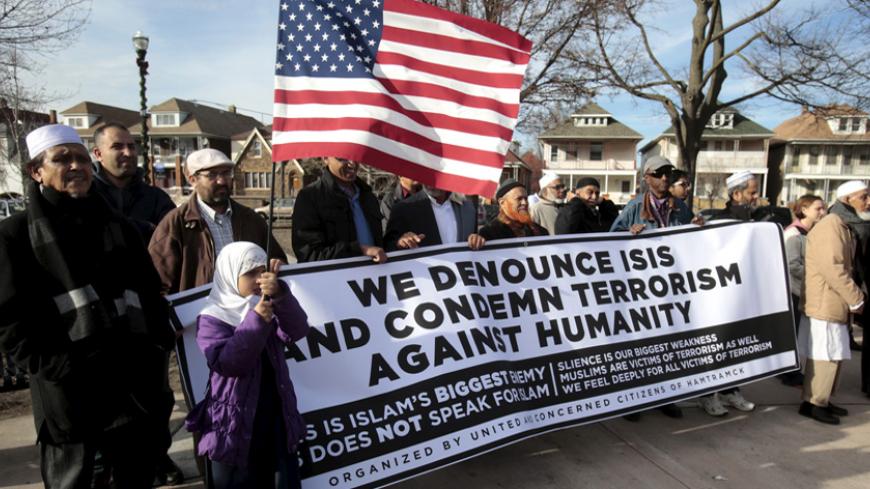 Bangladeshi and Yemeni Americans join supporters to protest against Islamic State and political and religious extremism during a rally in the Detroit suburb of Hamtramck, Michigan, December 11, 2015. REUTERS/Rebecca Cook - RTX1YBER
