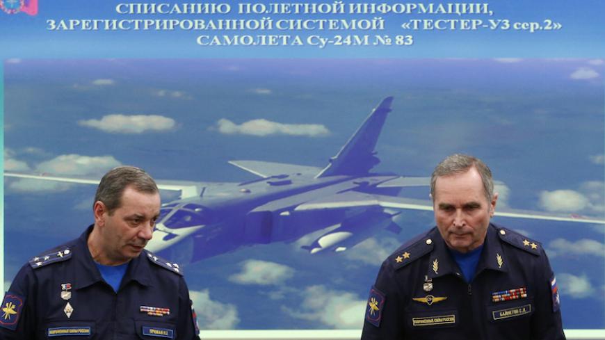 Sergei Bainetov (R), deputy chief of the Russian Armed Forces' flight safety service, and Nikolai Primak, Chairman of the Air Accident Investigation Commission, attend a news conference, dedicated to the crash of SU-24 fighter-bomber, a Russian warplane shot down by Turkey in November, in Moscow, Russia, December 21, 2015. REUTERS/Maxim Shemetov - RTX1ZMGZ