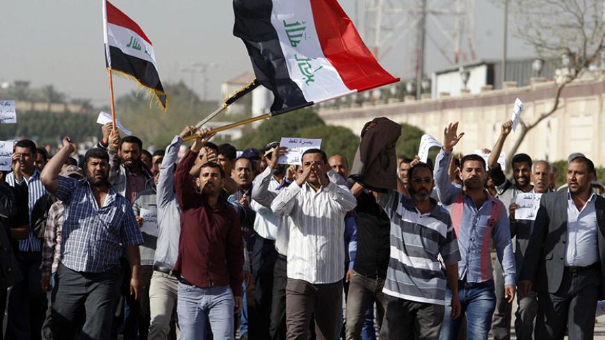 Staff from the South Oil Company (SOC) demonstrate to demand higher salaries and better benefits, in Basra, 420 km (261 miles) southeast of Baghdad, February 19, 2013.     REUTERS/Atef Hassan (IRAQ - Tags: CIVIL UNREST ENERGY) - RTR3DZET