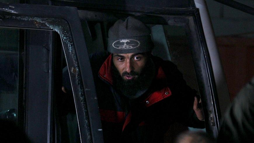 A Sunni Muslim rebel fighter who was trapped with other fighters in Zabadani, arrives at Bab al-Hawa near the Syrian-Turkish border December 29, 2015. A U.N. operation to evacuate around 450 Syrian fighters and their families from two besieged Syrian areas was completed on Monday with the arrival of planes carrying them to Beirut and Hatay airport in Turkey, U.N. and airport sources said. REUTERS/Ammar Abdullah - RTX20DJB