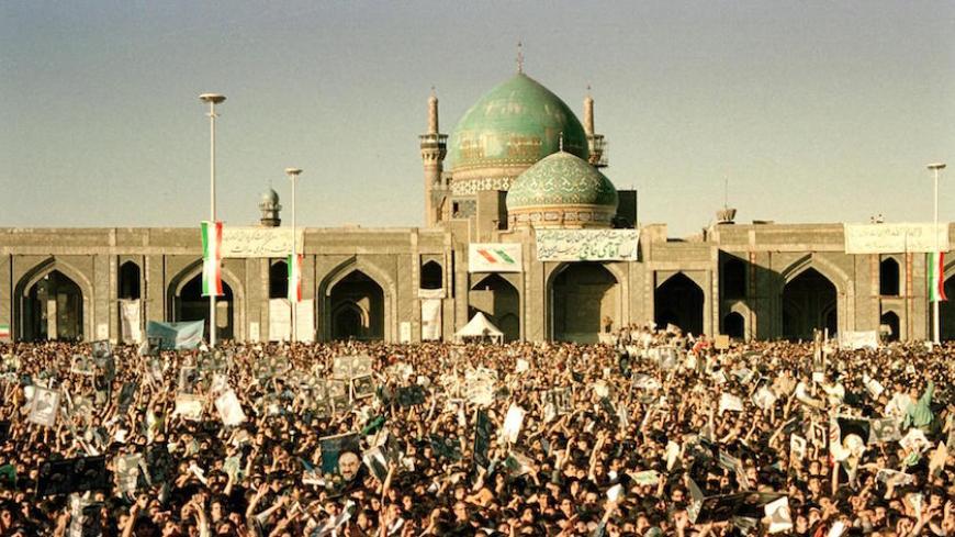 Thousands of Iranians from Mashhad welcome President Mohammad Khatami outside the Shiite Muslim shrine of Imam Reza in the northeastern holy city 05 June 2000. During the February parliamentary elections in Iran,  an ultra-conservative cleric was turned out of office and pro-Khatami reformers won all five seats in Mashhad, Iran's second largest city which is usually a right-wing stronghold. This is Khatami's first trip to the region since he came to power in 1997. (Photo credit should read ATTA KENARE/AFP/G