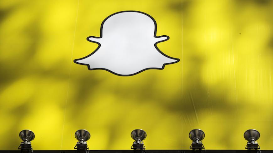 A billboard displays the logo of Snapchat above Times Square in New York March 12, 2015. REUTERS/Lucas Jackson (UNITED STATES - Tags: BUSINESS SOCIETY) - RTR4T544
