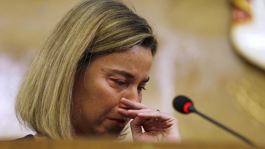 European Union foreign policy chief Federica Mogherini reacts to news of the Belgium blasts during a joint news conference with Jordanian Foreign Minister Nasser Judeh at the Ministry of Foreign Affairs in Amman March 22, 2016. REUTERS/Muhammad Hamed      TPX IMAGES OF THE DAY      - RTSBM88
