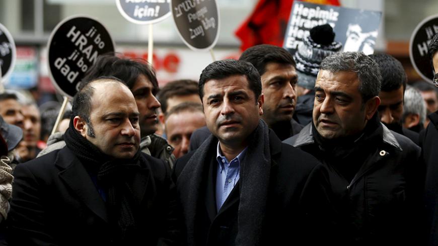 Co-chair of the pro-Kurdish Peoples' Democratic Party (HDP), Selahattin Demirtas (C) attends a ceremony to mark the ninth anniversary of the killing of Turkish-Armenian editor Hrant Dink in Istanbul January 19, 2016. REUTERS/Osman Orsal - RTX232RL
