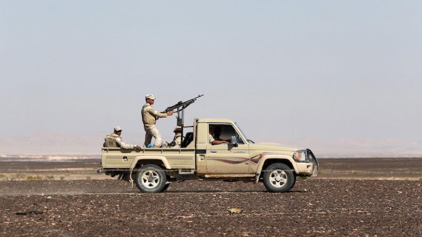 An Egyptian army vehicle guard the site where a Russian airliner crashed in the al-Hasanah area  in El Arish city, north Egypt, November 1, 2015. Russia has grounded Airbus A321 jets flown by the Kogalymavia airline, Interfax news agency reported on Sunday, after one of its fleet crashed in Egypt's Sinai Peninsula, killing all 224 people on board. REUTERS/Mohamed Abd El Ghany - RTX1U8ZS