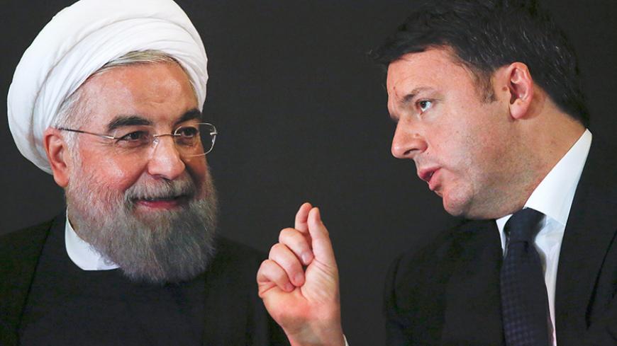 Iran President Hassan Rouhani (L) talks with Italian Prime Minister Matteo Renzi at the Campidoglio palace in Rome, Italy, January 25, 2016.  REUTERS/Alessandro Bianchi      TPX IMAGES OF THE DAY      - RTX23YOB