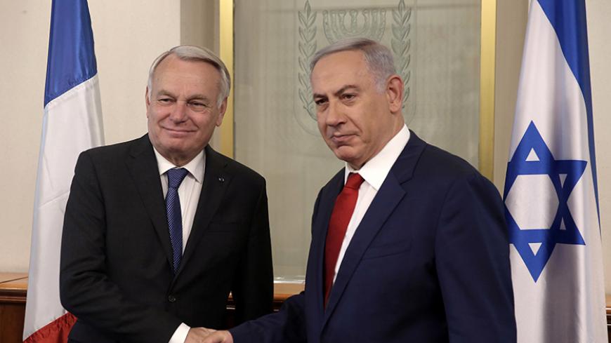 Israeli Prime Minister Benjamin Netanyahu (L) shakes hands with French Foreign Minister Jean-Marc Ayrault on May 15, 2016 during a meeting at the Prime Minister's office in Jerusalem.Ayrault met Netanyahu before meeting Palestinian president Mahmud Abbas ahead of a France-sponsored Middle East peace process summit in Paris on May 30. Israel has rejected the initiative, the Palestinians support it and the United States has been cold. REUTERS/ MENAHEM KAHANA/Pool - RTSECIN