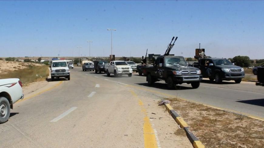 Forces aligned with Libya's new unity government are seen on the road as they advance on the eastern and southern outskirts of the Islamic State stronghold of Sirte, in this still image taken from video on June 9, 2016.   Via REUTERS TV - RTSGPGM