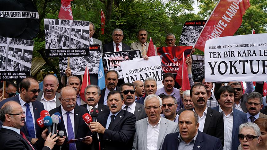 Turkish demonstrators stage a protest against approval of a resolution by Germany's parliament that declares the 1915 massacre of Armenians by Ottoman forces a "genocide" in front of the German Embassy in Ankara, Turkey, June 3, 2016. REUTERS/Umit Bektas - RTX2FHV5