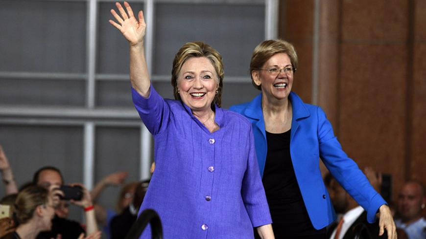 CINCINNATI, OH- JUNE 27:  Democratic Presidential candidate Hillary Clinton (L) and Senator  Elizabeth Warren  (R) wave to the crowd before a campaign rally at the Cincinnati Museum Center at Union Terminal June 27, 2016 in Cincinnati, Ohio. Warren is helping Clinton campaign in Ohio.   (Photo by John Sommers II/Getty Images)