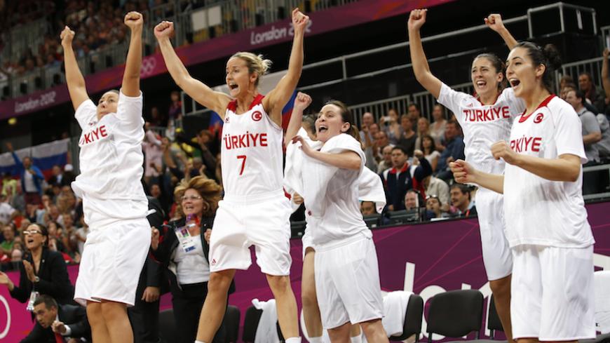Turkey celebrates before being defeated by Russia in their women's quarterfinal basketball match at the Basketball Arena in London during the London 2012 Olympic Games August 7, 2012. REUTERS/Mike Segar (BRITAIN  - Tags: SPORT OLYMPICS SPORT BASKETBALL)   - RTR36EGF